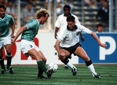 Chris Waddle take on Germany's Andreas Brehme.