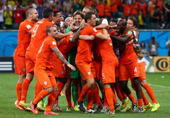 Tim Krul is mobbed by his team as Holland progress to the semi-final.